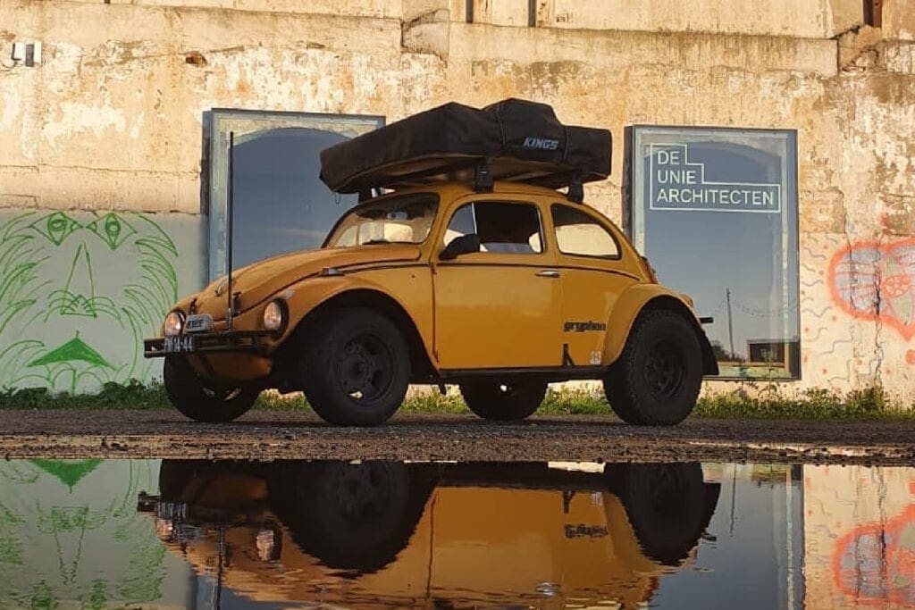 1964 Overland Baja Bug outside near large puddle